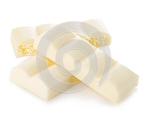 White chocolate pieces close-up isolated on a white.