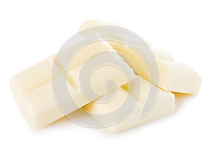 White chocolate pieces close-up isolated on a white.