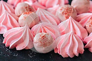 White chocolate strawberry truffles and pink meringue kisses on