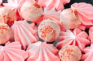 White chocolate and strawberry truffles and pink meringue kisses