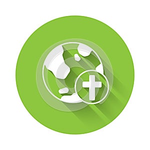 White Christian cross with globe Earth icon isolated with long shadow background. World religion day. Green circle