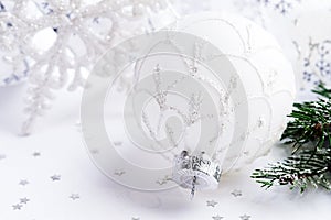 White Christmas ball,fir branch and snowflake on white bacground