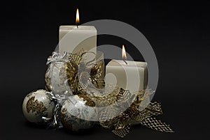 White Christmas candles and balls.