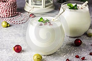 White Christmas cocktail coconut Mojito drink on festive background