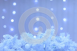 White christmas decoration with lights on the blue background. F