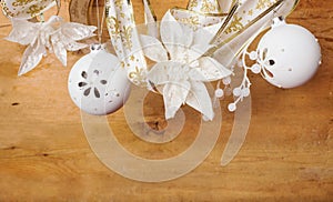 White  christmas  decorations hanging over wooden  background