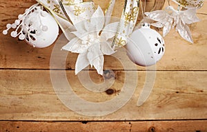 White  christmas  decorations hanging over wooden  background
