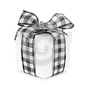 White Christmas gift box with black and white buffalo plaid bow and ribbon isolated on white