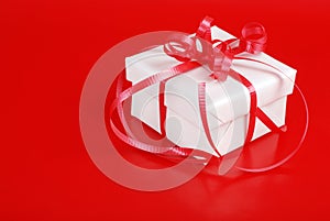 White christmas gift with red ribbon