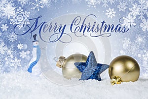 White Christmas scene with gold and blue ornaments