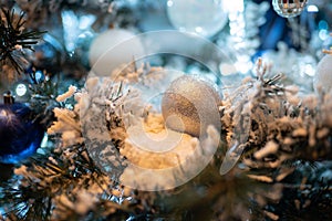 White christmas silver ball ornament on a new year tree