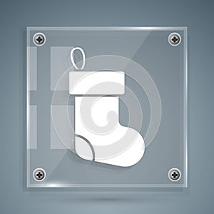White Christmas stocking icon isolated on grey background. Merry Christmas and Happy New Year. Square glass panels. Vector
