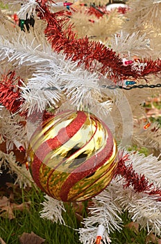 White Christmas tree color lights red and gold striped ball ornament