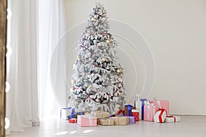 White Christmas tree with gifts Garland lights new year winter holiday