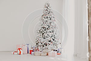 White Christmas tree with gifts Garland lights new year winter holiday