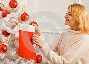White christmas tree red balls. Christmas stockings. Home Christmas atmosphere. Winter holidays and people concept.