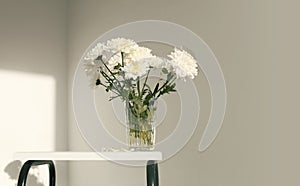 White chrysanthemums flower in glass in interior. Selective soft focus. Minimalist smoke still life. Light and shadow nature