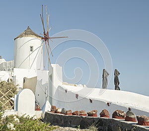 White Church with bells and blue dome at Oia, Santorini, Greek Islands