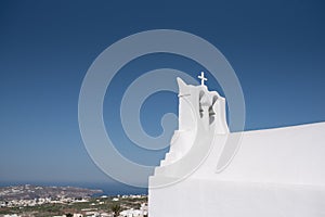 White church bells in Pyrgos, Santorini island, Greece