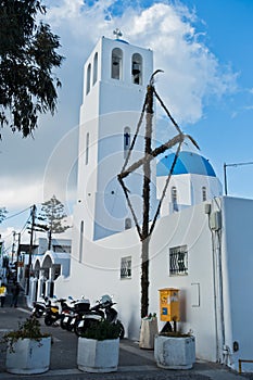 White church with blue dome at Oia village, Santorini island