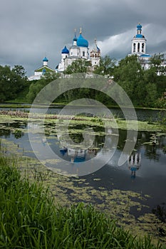 White church with blue domes and scenic clouds, Bogolubovo, Russ