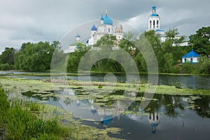 White church with blue domes and scenic clouds, Bogolubovo, Russ