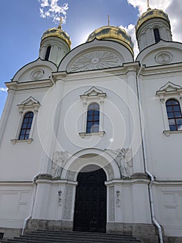 White church with golden domes