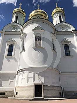 White church with golden domes