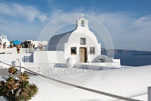 A white church in Oia village, Santorini island, Greece