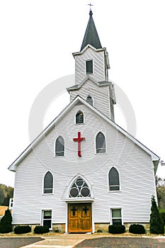 White Church with Red Cross and Steeple photo