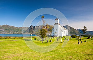 White church and small cemetery in Bardstrand,Norway