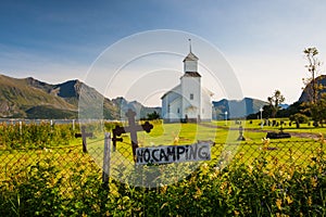 White church and small cemetery in Bardstrand,Norway