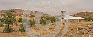 White Church from Town Aus, Namibia, background cloudy sky