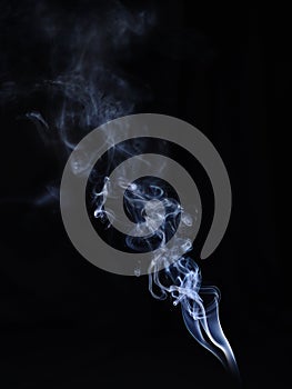 White cigarette smoke on a black background