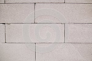 White cinder block wall textured background.