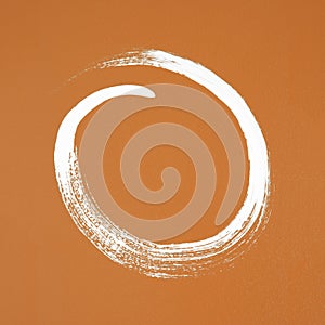 White circle painted on orange background