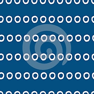 White Circle Pattern with pantone color of the year classic blue background. Seamless repeat pattern. Stylish repeating texture