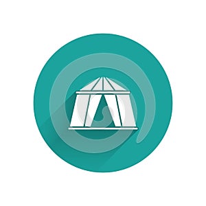 White Circus tent icon isolated with long shadow. Carnival camping tent. Amusement park. Green circle button. Vector