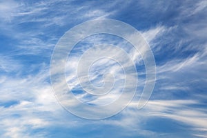White cirrus clouds on blue sky