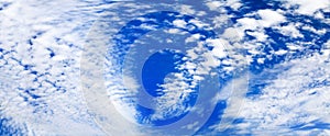 White cirrus clouds blue sky background, beautiful wispy cloudscape wide panoramic view, cumulus cloudy skies panorama, cloudiness