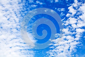 White cirrus clouds blue sky background closeup, fluffy cumulus cloud texture, cloudscape, cloudy weather, cloudiness, ozone layer