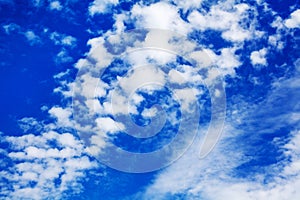 White cirrus clouds blue sky background closeup, fluffy cumulus cloud texture, cloudscape, cloudy weather, cloudiness, ozone layer