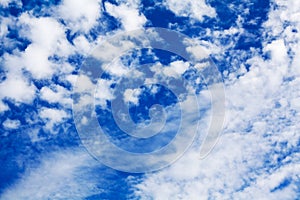 White cirrus clouds blue sky background closeup, fluffy cumulus cloud texture, cloudscape, cloudy weather, cloudiness, ozone layer