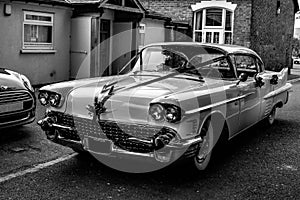 White classic cadillac car made up for wedding in black and white