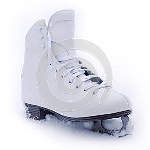 White classical iceskate shoe partially covered in snow photo