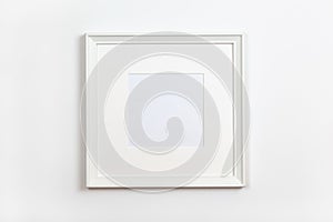 White clean square frame with passepartout on white background, copy space. Flat lay or side view, minimal style mock-up. For gift