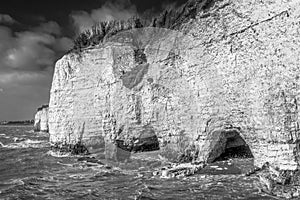 White cliffs and arches at high tide at Pegwell Bay, Kent, Thanet, seen from Ramsgate Royal Harbour Approach road