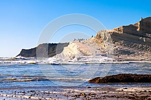 White cliffs naturally made of smooth pug at Scala dei Turchi beach with stormy mediterranean sea, Sicily, Italy