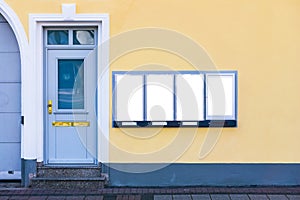 White clipped mockups on a yellow wall