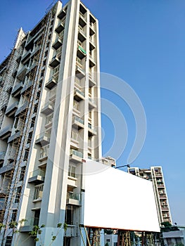 white clipping mock up for the advertisement with some ornamentation below the huge tall building